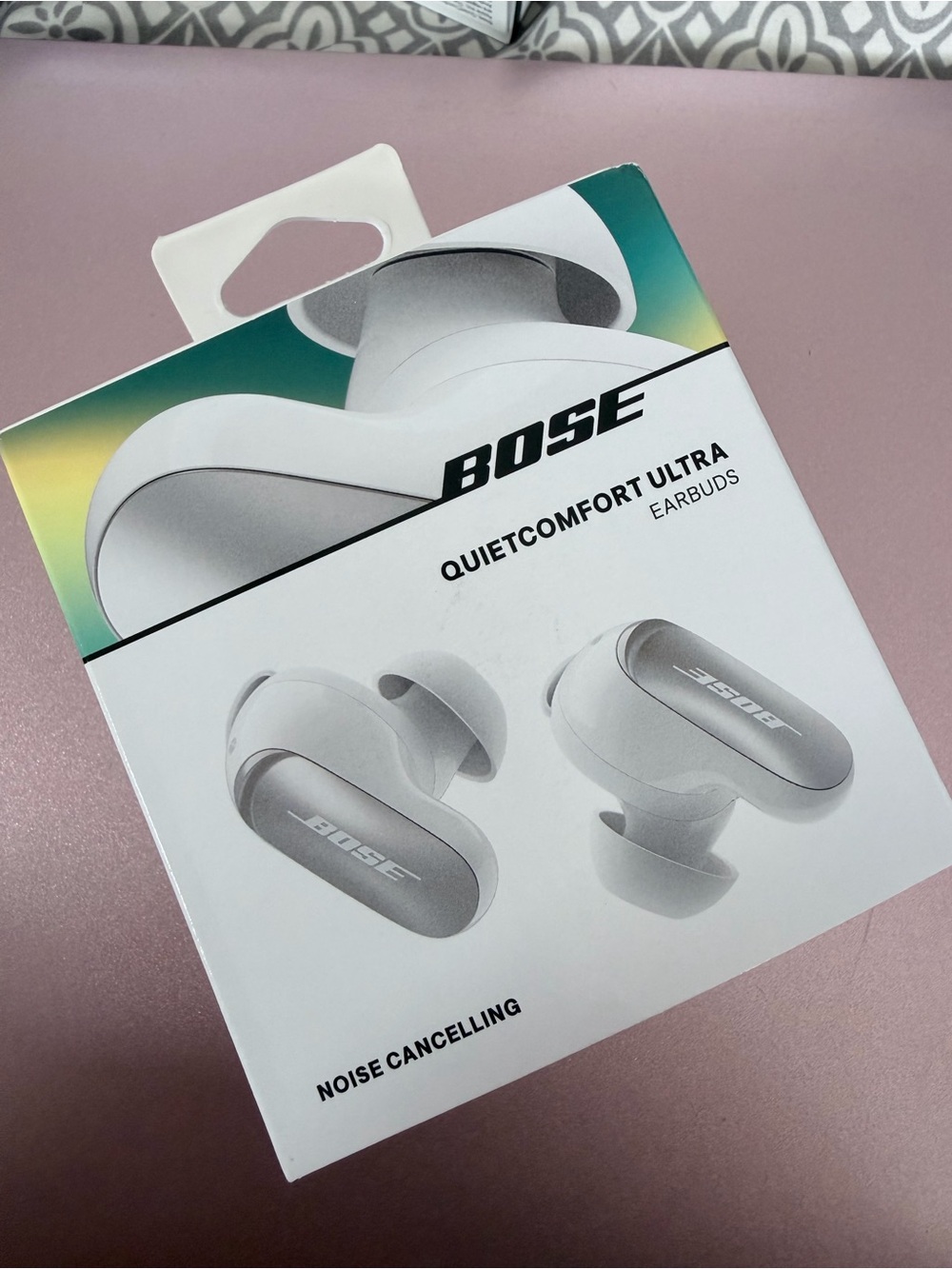 Bose Earbuds Packaging with White and Teal Accents